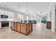 Open concept kitchen with stainless steel appliances and granite countertops looking into the living room at 8469 Cape Dutch Loop, Myrtle Beach, SC 29572
