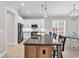 An open-concept kitchen offers stainless steel appliances, a center island, and a cozy breakfast nook at 8469 Cape Dutch Loop, Myrtle Beach, SC 29572
