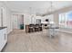 An open concept design connects the kitchen to the living room with wood floors and lots of natural light at 8469 Cape Dutch Loop, Myrtle Beach, SC 29572
