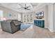 A bright living room showcases tile floors, a tray ceiling, and a cozy seating area at 8469 Cape Dutch Loop, Myrtle Beach, SC 29572