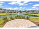 Picturesque pond view showcasing lush landscaping, fountain, and neighboring homes creating a tranquil community setting at 8469 Cape Dutch Loop, Myrtle Beach, SC 29572