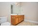 Bright bathroom featuring a single sink vanity, tile floors, and a standard toilet at 908 Wrigley Dr. # 17-3_17-3G, Myrtle Beach, SC 29588