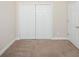 Clean bedroom with carpeted flooring, white trim and a double door closet provides ample storage at 908 Wrigley Dr. # 17-3_17-3G, Myrtle Beach, SC 29588