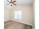 Bright bedroom with a ceiling fan, carpet flooring, and a large window at 908 Wrigley Dr. # 17-3_17-3G, Myrtle Beach, SC 29588