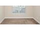 Neutral bedroom featuring plush carpet, base molding, and a bright window at 908 Wrigley Dr. # 17-3_17-3G, Myrtle Beach, SC 29588