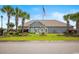 Clubhouse exterior, featuring well-manicured landscaping and palm trees at 908 Wrigley Dr. # 17-3_17-3G, Myrtle Beach, SC 29588