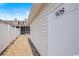 View of the side of the home with a brick-paved walkway and vinyl fence at 908 Wrigley Dr. # 17-3_17-3G, Myrtle Beach, SC 29588