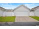 A spacious two-car garage with an expansive driveway offers plenty of parking space at 908 Wrigley Dr. # 17-3_17-3G, Myrtle Beach, SC 29588