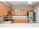 Well-lit kitchen with stainless steel appliances, wood cabinets, and ample counter space at 908 Wrigley Dr. # 17-3_17-3G, Myrtle Beach, SC 29588
