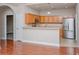 Bright kitchen featuring wood cabinets, stainless steel appliances, and a functional breakfast bar at 908 Wrigley Dr. # 17-3_17-3G, Myrtle Beach, SC 29588