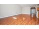 Large living room with wood floors, view of front door, and hanging light fixture at 908 Wrigley Dr. # 17-3_17-3G, Myrtle Beach, SC 29588