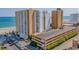 View of the Sands Ocean Club exterior showcasing oceanfront access, parking, and nearby beach at 9550 Shore Dr. # 529, Myrtle Beach, SC 29572