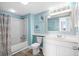 Well-lit bathroom features white fixtures and vibrant turtle artwork at 9550 Shore Dr. # 529, Myrtle Beach, SC 29572
