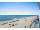 Expansive beach view with ocean, umbrellas, and lounge chairs, perfect for relaxation and enjoying the coastal atmosphere at 9550 Shore Dr. # 529, Myrtle Beach, SC 29572