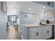 Well-designed kitchen with a view into the ocean view living room and modern white cabinets, and stainless appliances at 9550 Shore Dr. # 529, Myrtle Beach, SC 29572