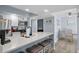 Modern kitchen with white cabinets, stainless steel appliances, and a breakfast bar with seating for three at 9550 Shore Dr. # 529, Myrtle Beach, SC 29572