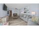 Cozy living room featuring a comfortable sofa, recliner, and light blue walls that create a relaxing and inviting atmosphere at 9550 Shore Dr. # 529, Myrtle Beach, SC 29572