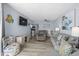 Spacious living room with light blue walls, seating, dining area, and an ocean view at 9550 Shore Dr. # 529, Myrtle Beach, SC 29572