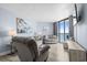Bright living room featuring comfortable seating, decor, and sliding glass doors to the balcony at 9550 Shore Dr. # 529, Myrtle Beach, SC 29572