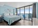 Inviting main bedroom with ocean view, large bed, and access to the balcony at 9550 Shore Dr. # 529, Myrtle Beach, SC 29572