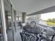 Expansive balcony offers a cozy seating arrangement, complemented by the ocean view, ideal for relaxation and entertainment at 9840 Queensway Blvd. # 227, Myrtle Beach, SC 29572