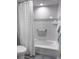 Bathroom with shower/tub combo, white subway tile, and a white shower curtain at 9840 Queensway Blvd. # 227, Myrtle Beach, SC 29572