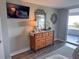 Bedroom with dresser, mirror, TV and sliding glass door to the balcony at 9840 Queensway Blvd. # 227, Myrtle Beach, SC 29572
