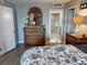 Bedroom featuring a decorative dresser and a doorway leading into the bathroom at 9840 Queensway Blvd. # 227, Myrtle Beach, SC 29572