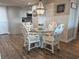 Dining room featuring a round glass table, decorative chairs and a modern chandelier at 9840 Queensway Blvd. # 227, Myrtle Beach, SC 29572
