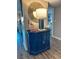 Hallway featuring a blue accent cabinet with decorative lamp, mirror, and coastal decor at 9840 Queensway Blvd. # 227, Myrtle Beach, SC 29572