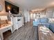 Elegant living room showcases modern decor, comfortable seating, and seamless flow to dining area, creating an inviting space at 9840 Queensway Blvd. # 227, Myrtle Beach, SC 29572
