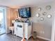 Comfortable living room features a wall-mounted TV and stylish white storage cabinet at 9840 Queensway Blvd. # 227, Myrtle Beach, SC 29572