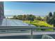Picturesque view of the well-manicured lawn and beach, visible from the balcony, which is a perfect relaxation spot at 9840 Queensway Blvd. # 227, Myrtle Beach, SC 29572