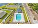 Aerial view showcasing the community pool with lounge chairs and umbrellas surrounded by greenery at 1008 Mary Read Dr., North Myrtle Beach, SC 29582
