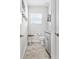 Modern bathroom features a toilet, gray vanity, and neutral tile flooring at 1008 Mary Read Dr., North Myrtle Beach, SC 29582