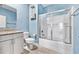 Bathroom featuring blue walls, granite countertop, and shower at 1008 Mary Read Dr., North Myrtle Beach, SC 29582