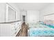 Bright bedroom featuring a bed, dresser, and a large mirror at 1008 Mary Read Dr., North Myrtle Beach, SC 29582