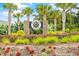 The Robber's Roost community entrance with lush landscaping and palm trees creating a welcoming atmosphere at 1008 Mary Read Dr., North Myrtle Beach, SC 29582