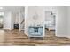 Charming entryway features stylish console table and wood-look floors leading to a bedroom at 1008 Mary Read Dr., North Myrtle Beach, SC 29582