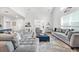 Spacious living room boasts high ceilings, comfortable sofas, and stylish decor at 1008 Mary Read Dr., North Myrtle Beach, SC 29582