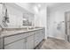 Main bathroom with a double sink vanity, granite counters and walk-in shower at 1008 Mary Read Dr., North Myrtle Beach, SC 29582