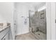 Stylish bathroom shower features tile surround, built-in niche, and glass door at 1008 Mary Read Dr., North Myrtle Beach, SC 29582