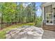 Backyard features a concrete patio area and lush greenery, perfect for outdoor enjoyment at 103 Pigeon Forge Ct., Murrells Inlet, SC 29576