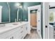 Bathroom with double vanity, quartz countertop, and stylish fixtures offering modern luxury and functionality at 103 Pigeon Forge Ct., Murrells Inlet, SC 29576