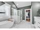 Spa-like bathroom with a soaking tub, glass-enclosed shower, and luxurious finishes at 103 Pigeon Forge Ct., Murrells Inlet, SC 29576