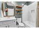 This bathroom offers a shower, shelving, and elegant fixtures at 103 Pigeon Forge Ct., Murrells Inlet, SC 29576