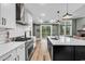 Gourmet kitchen featuring stainless steel appliances, a large island, and access to the outdoor space at 103 Pigeon Forge Ct., Murrells Inlet, SC 29576