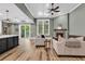 The living room has a cozy fireplace and seamless access to the outdoor patio at 103 Pigeon Forge Ct., Murrells Inlet, SC 29576