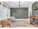Stylish living area showcases natural light, complemented by comfortable chairs and unique decor at 103 Pigeon Forge Ct., Murrells Inlet, SC 29576