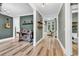 Open-concept living area boasts hardwood floors and neutral paint, flowing into other rooms of the home at 103 Pigeon Forge Ct., Murrells Inlet, SC 29576